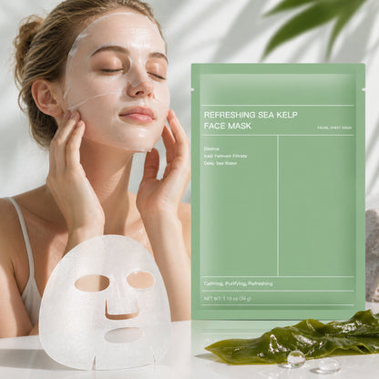 Woman applying a sea kelp face mask with the product packaging displayed.